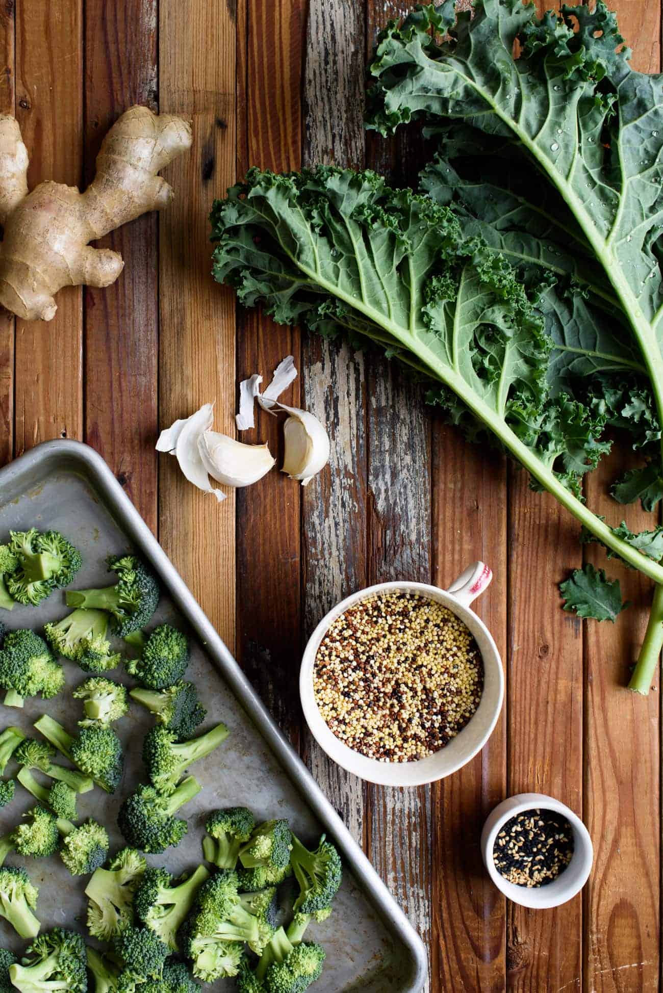 Ingredients to make vegan Asian-style grain bowl laid out on a wooden table
