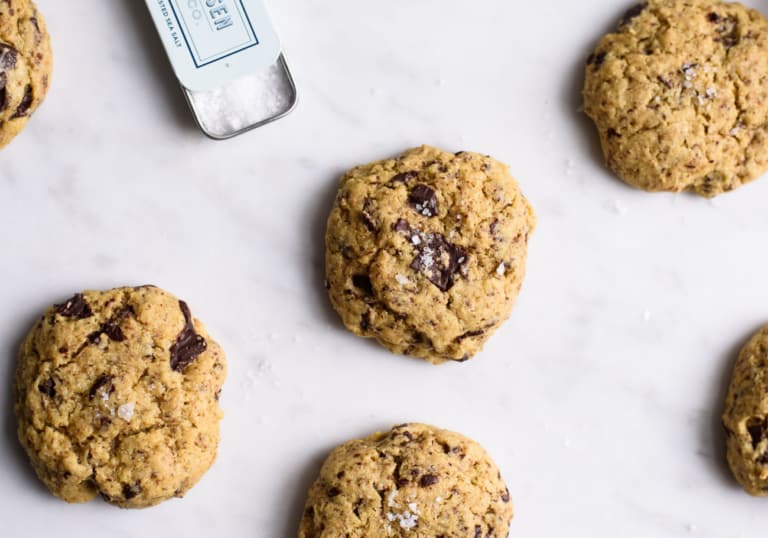 Chickpea Chocolate Chip Cookies on a marble board with sea salt