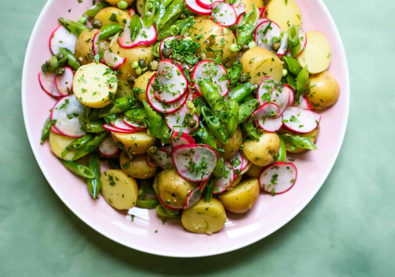 Mayo-less potato salad with radishes, sugar snap peas and lemon vinaigrette