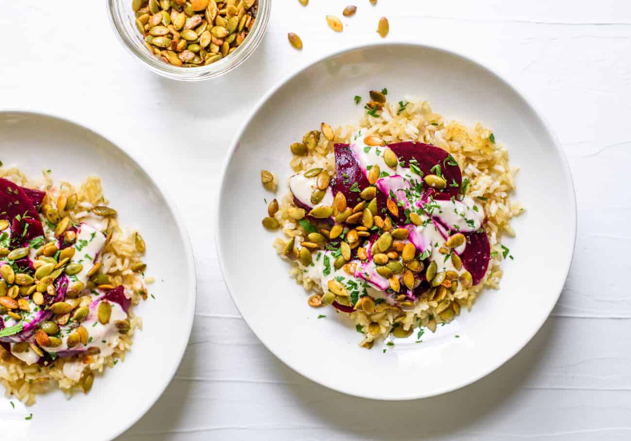 Crispy brown rice bowls with beets, spiced pepitas and tahini sauce