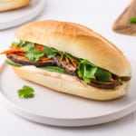 Vegetarian banh mi sandwich on a white plate