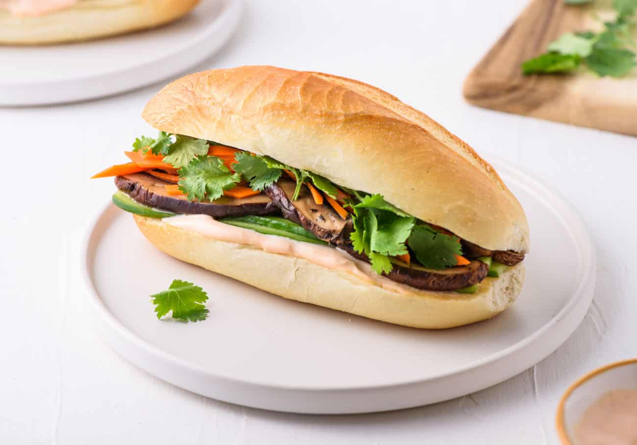 Vegetarian banh mi sandwich on a white plate