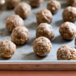 Peanut butter energy balls on a small baking tray