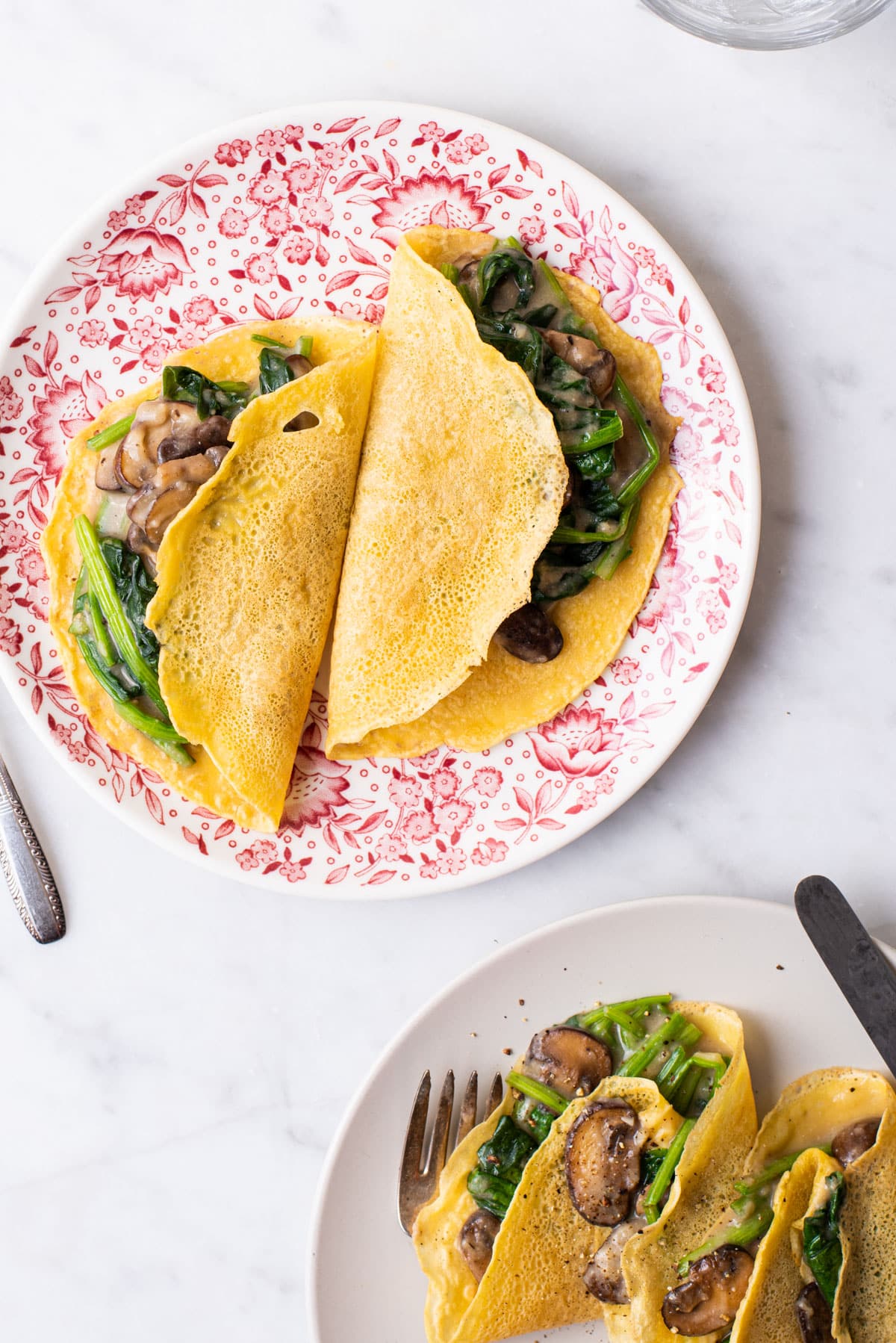 Savory vegan chickpea crepes with mushroom-spinach filling.