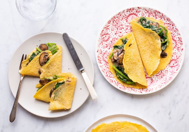 Savory chickpea crepes with creamy spinach and mushrooms.