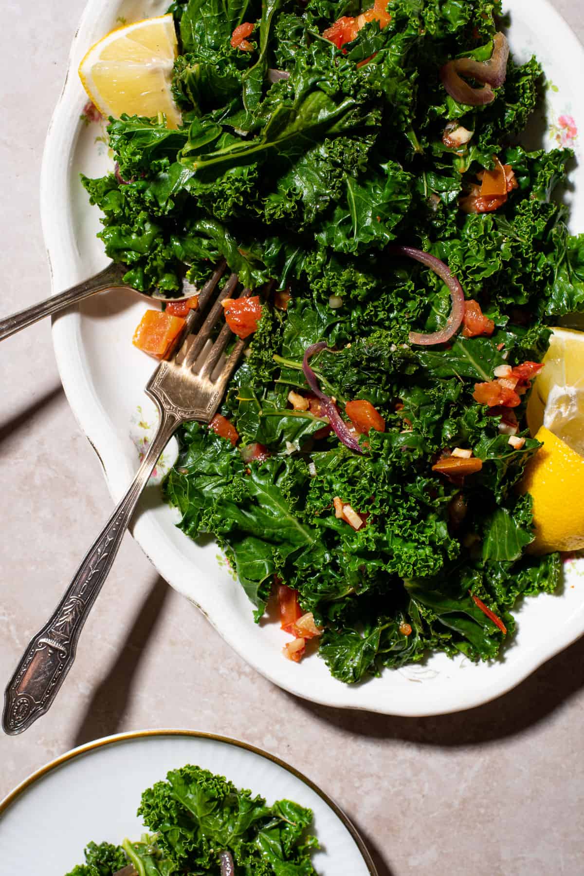 Lemon garlic kale with tomatoes and red onion.