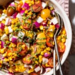 Tomato peach salad with red onion, basil, and corn.