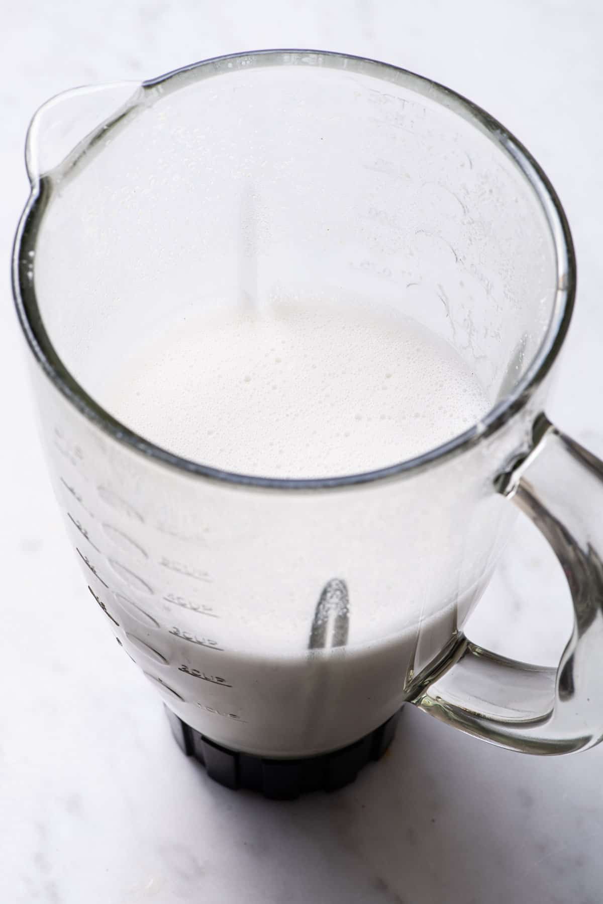 Homemade cashew milk in a blender.