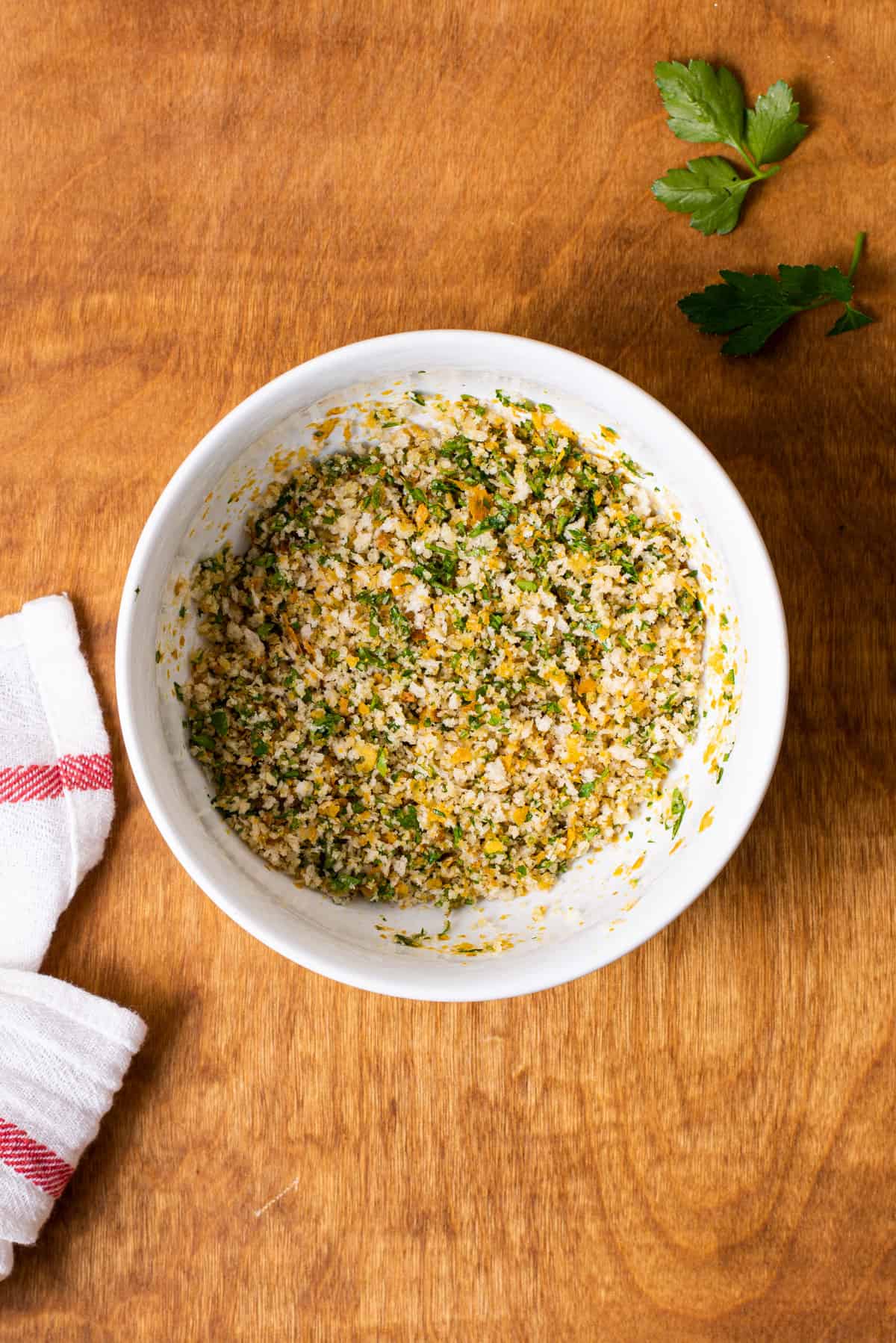 Panko-parsley mixture in a white bowl.