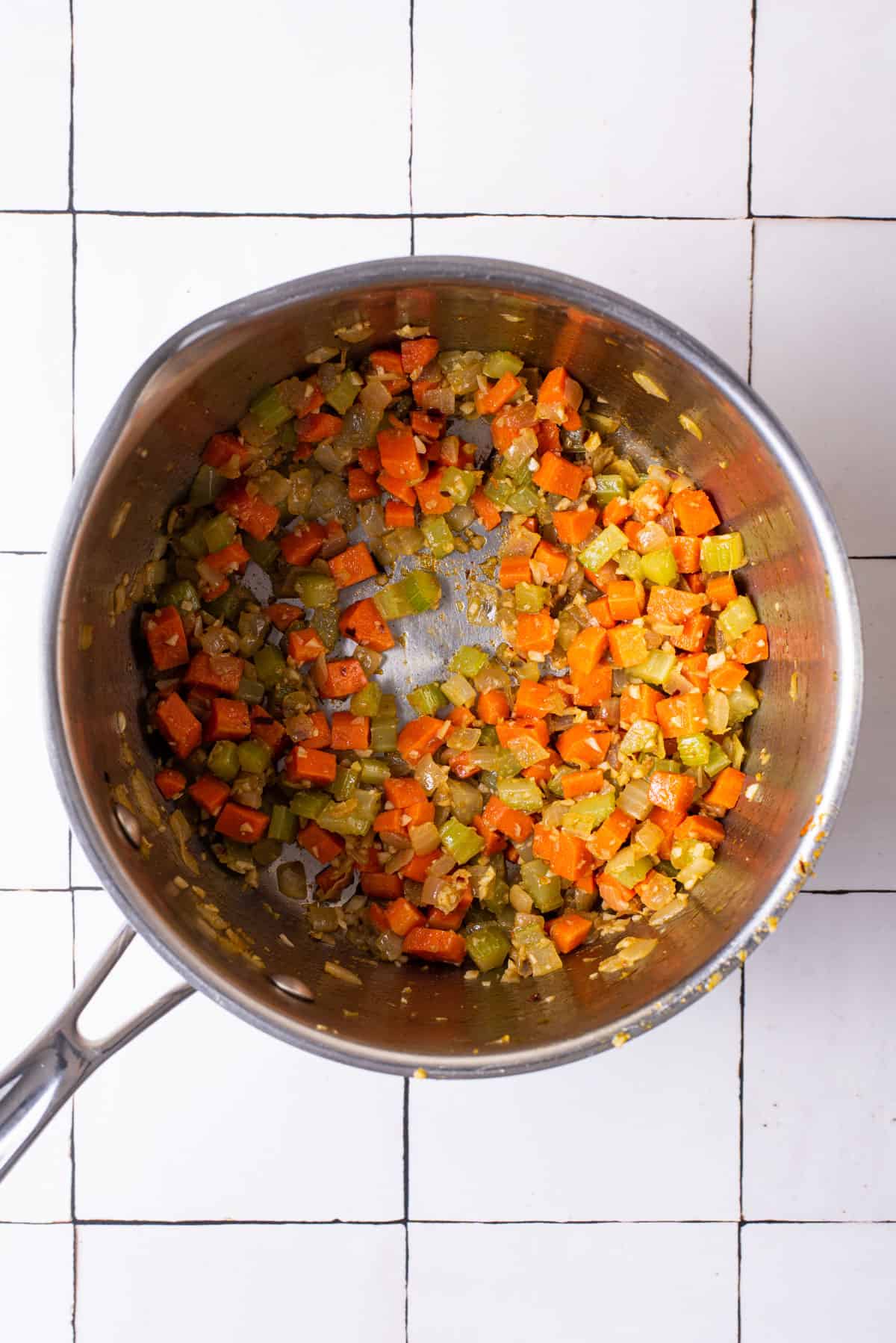 Cooked mirepoix in a pot.