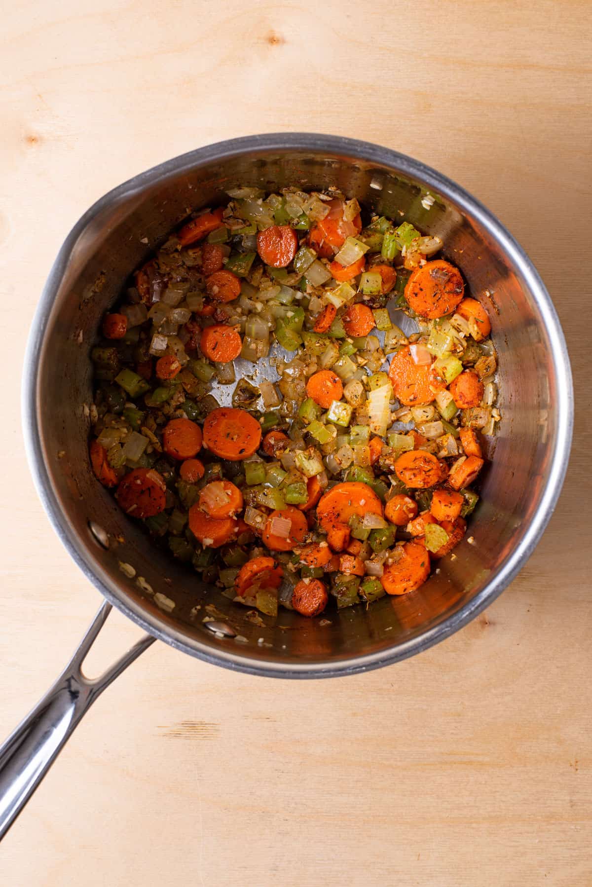 Sauteed mirepoix in a pot.