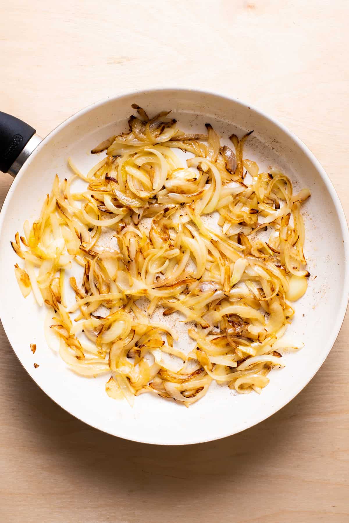 Browned onions in a skillet.