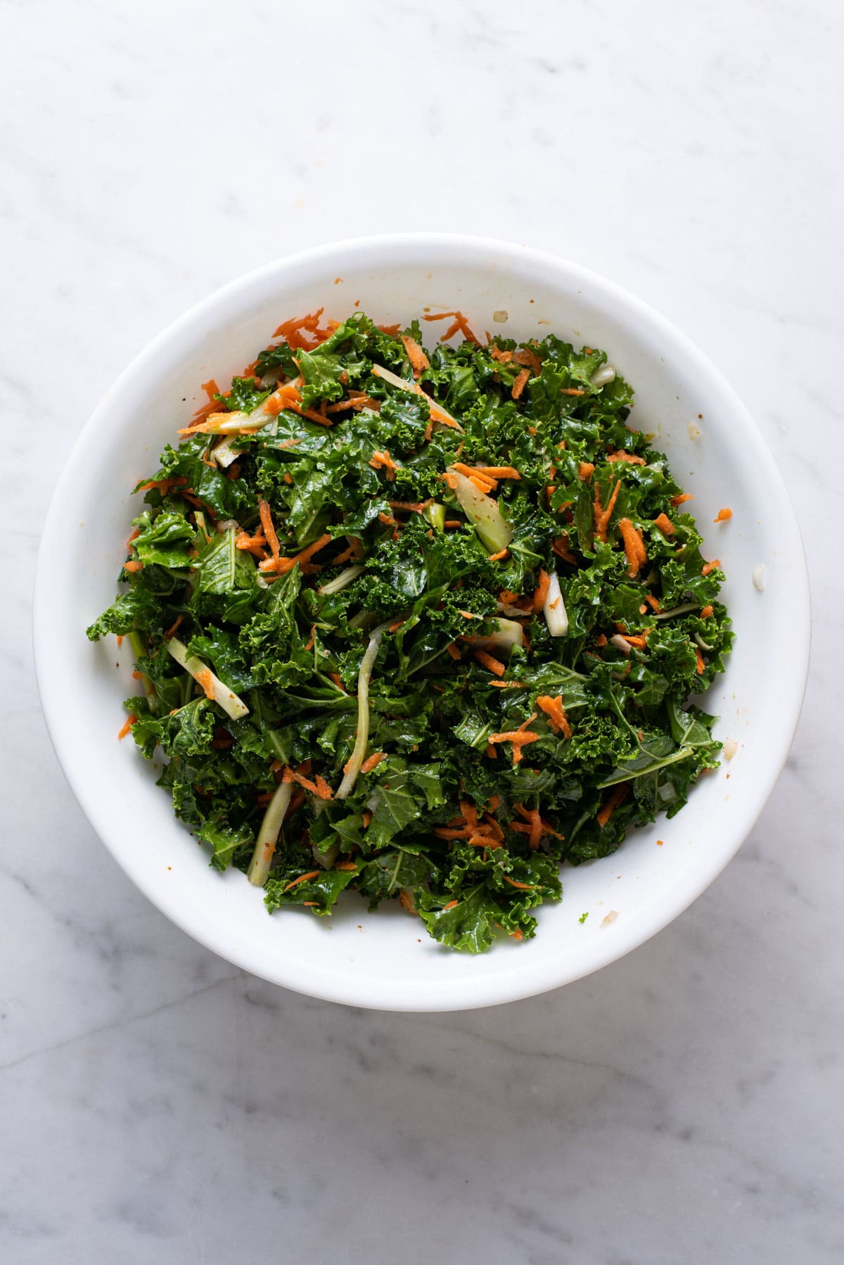 Massaged kale and fennel in a bowl.