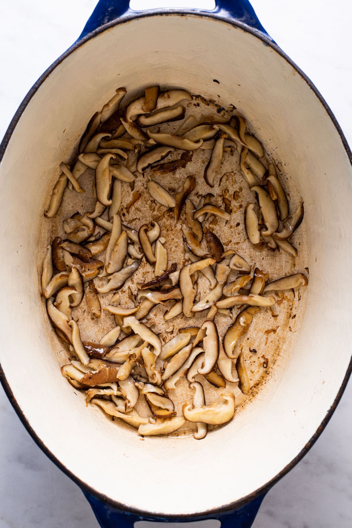 Sauteed mushrooms in a Dutch oven.