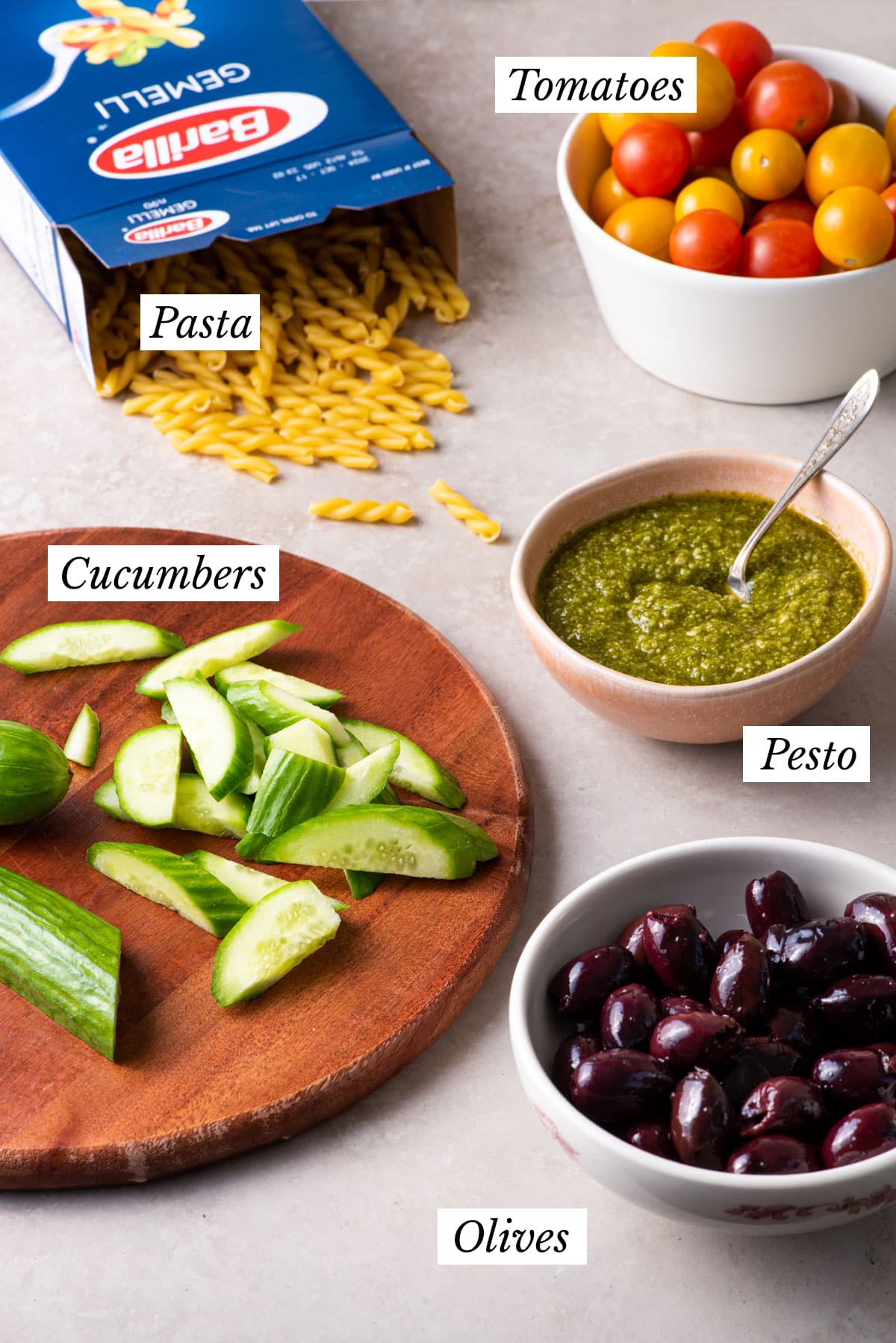 Ingredients gathered to make a vegan pesto pasta salad recipe.
