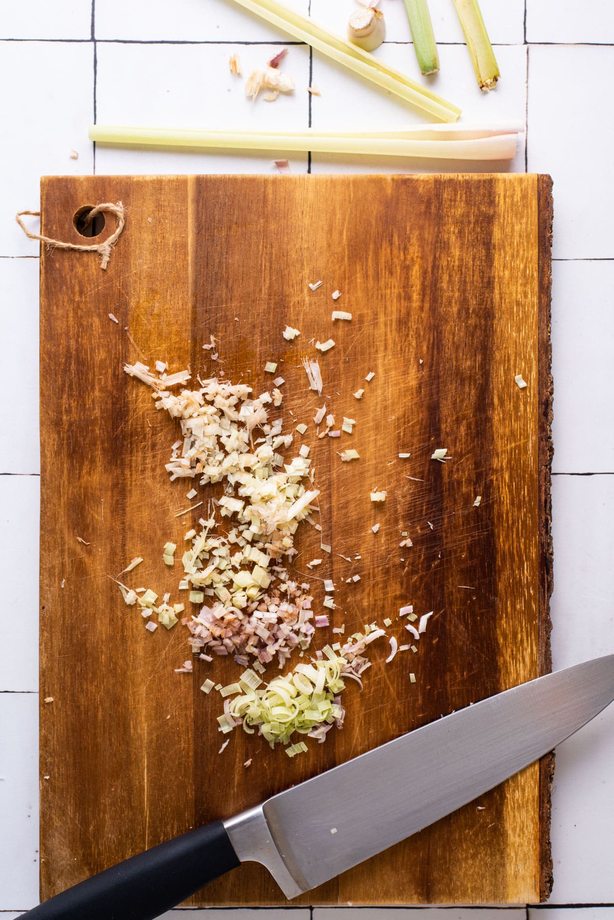 Minced lemongrass on a cutting board.