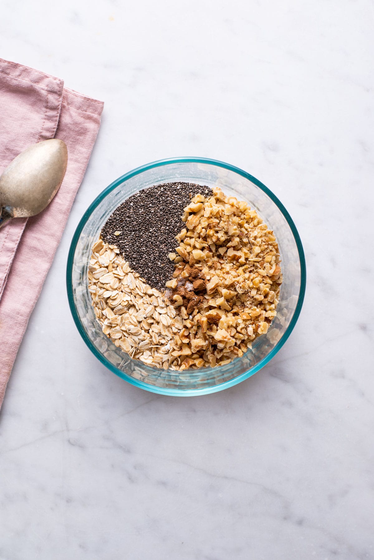 Ingredients combined in a bowl to make overnight oats with chia seeds.
