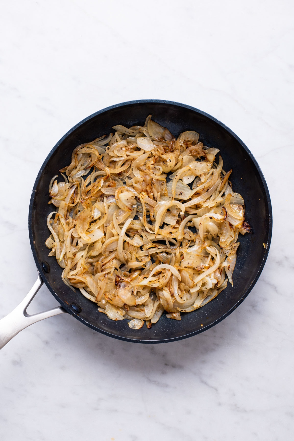 Caramelized onions in a skillet.