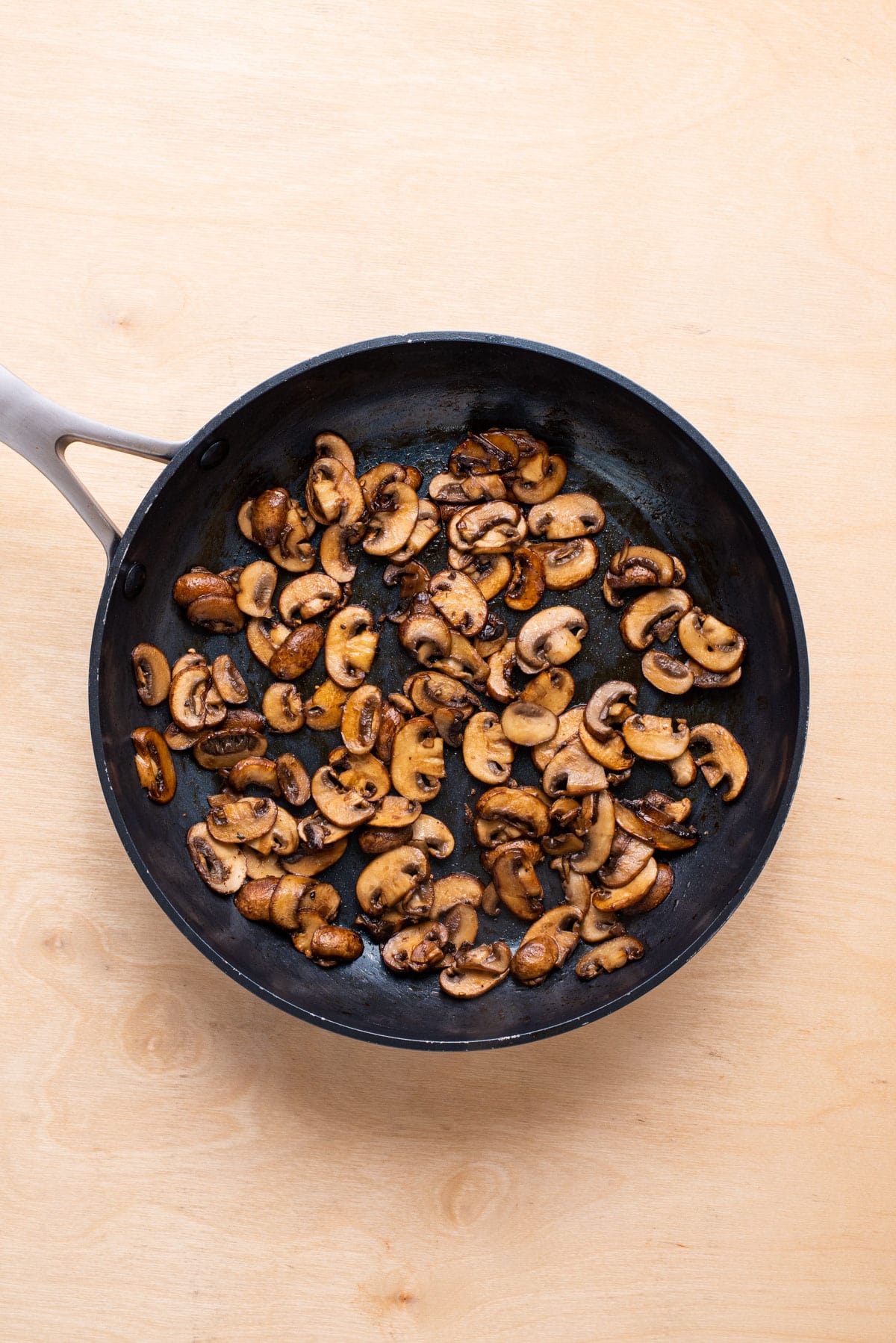 Sauteed balsamic mushrooms in a skillet.