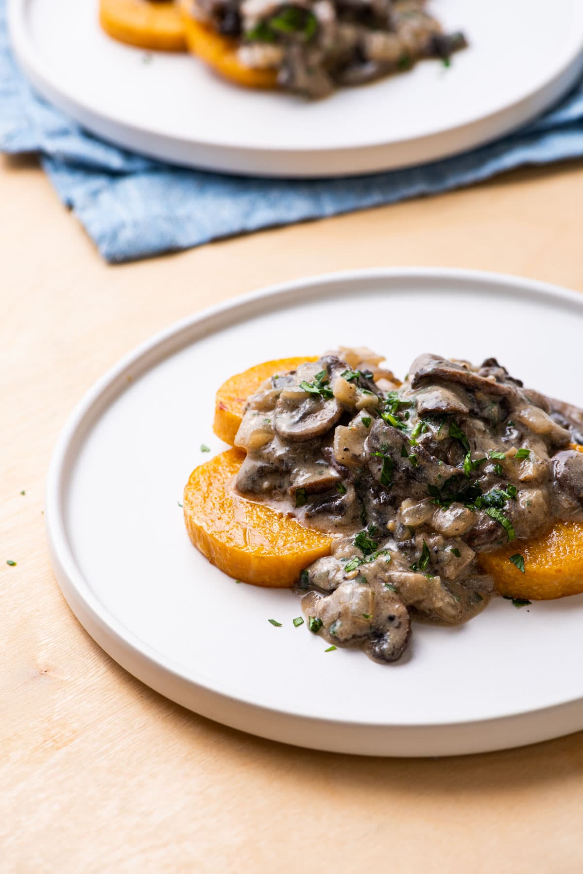 Baked polenta rounds (made with tube polenta) topped with creamy mushroom sauce.