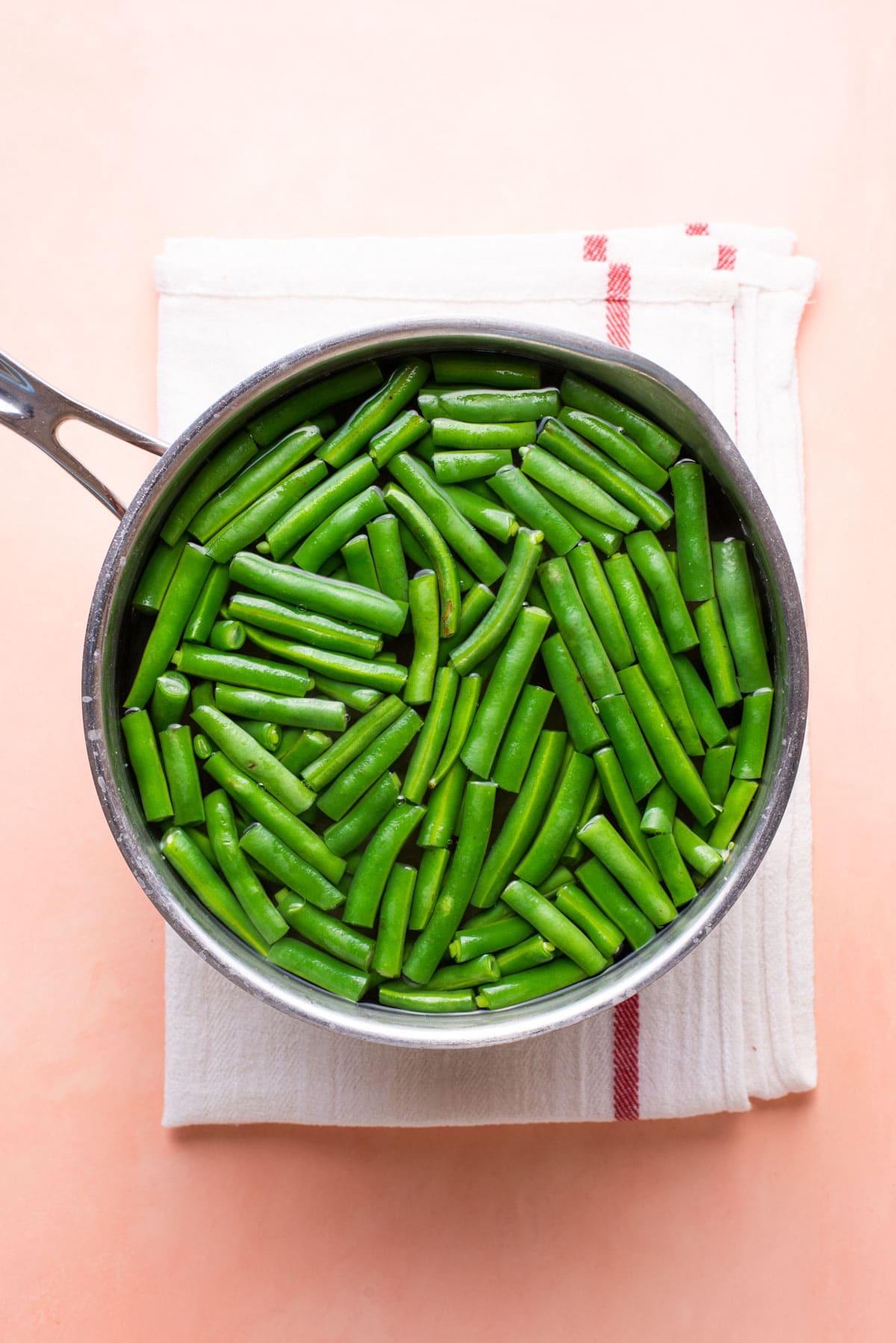Green beans boiling in a pot.