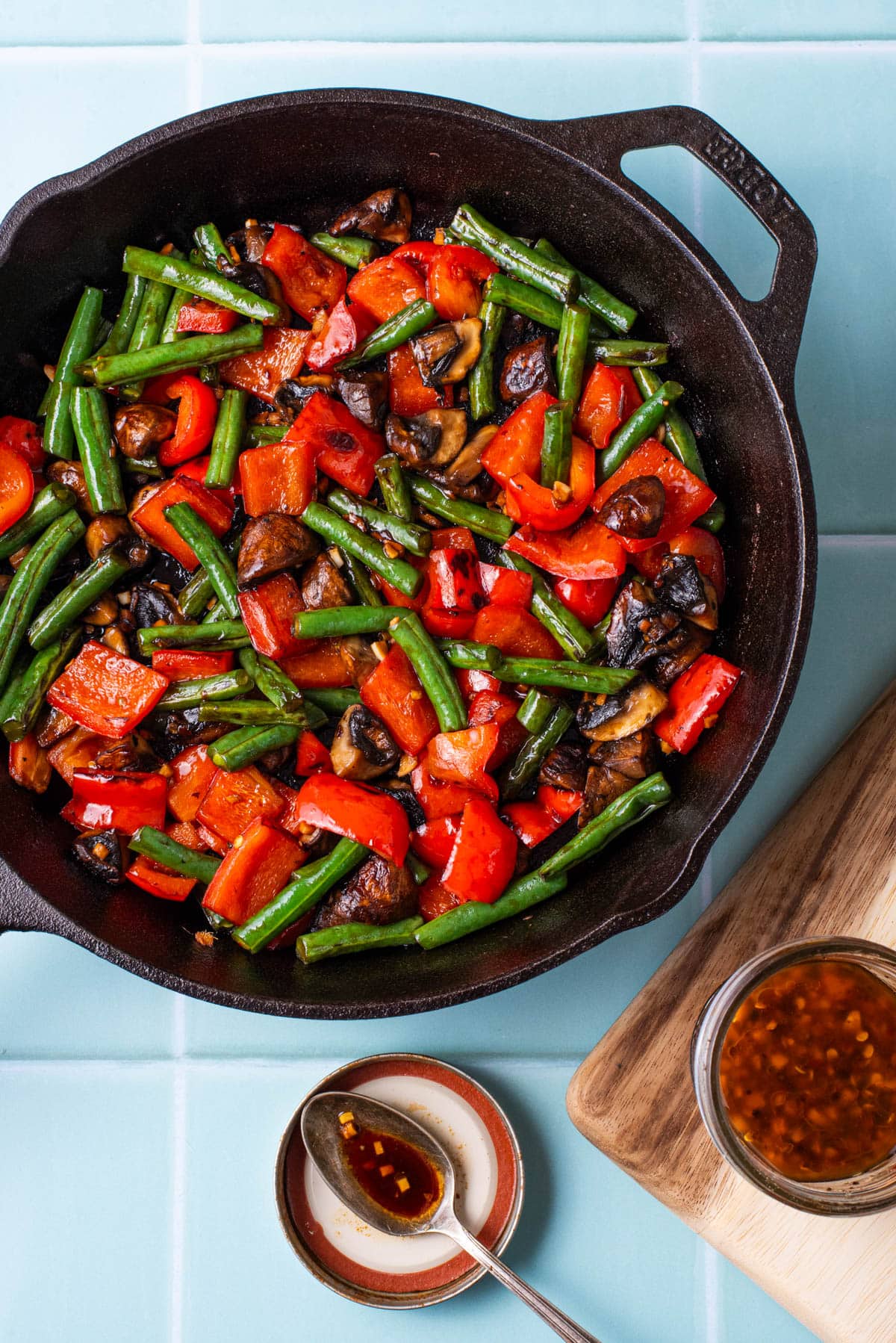 Stir fried vegetables in cast iron skillet with homemade sauce.