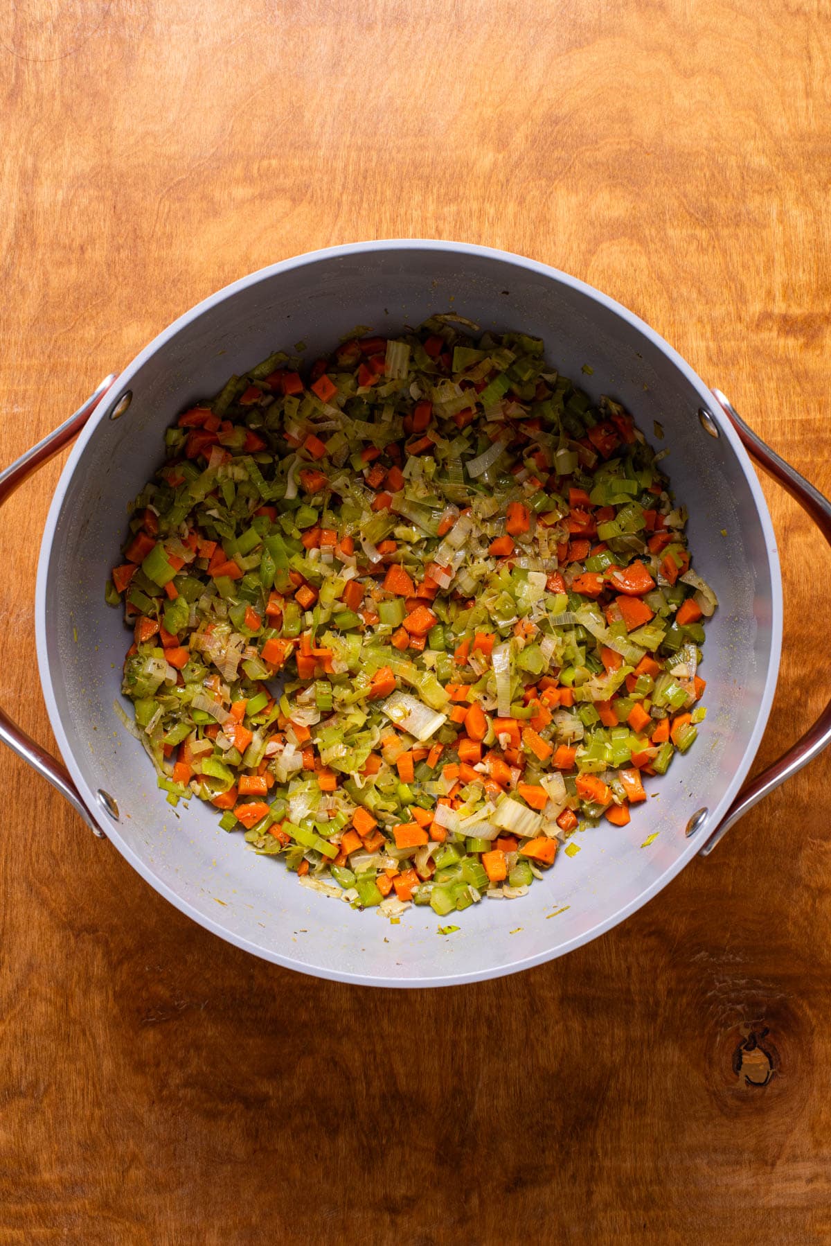 Sauteed mirepoix with leeks in a Dutch oven.