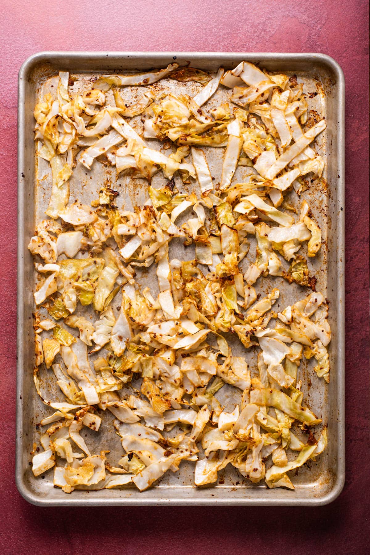 Miso-balsamic sliced roasted cabbage on a baking sheet.