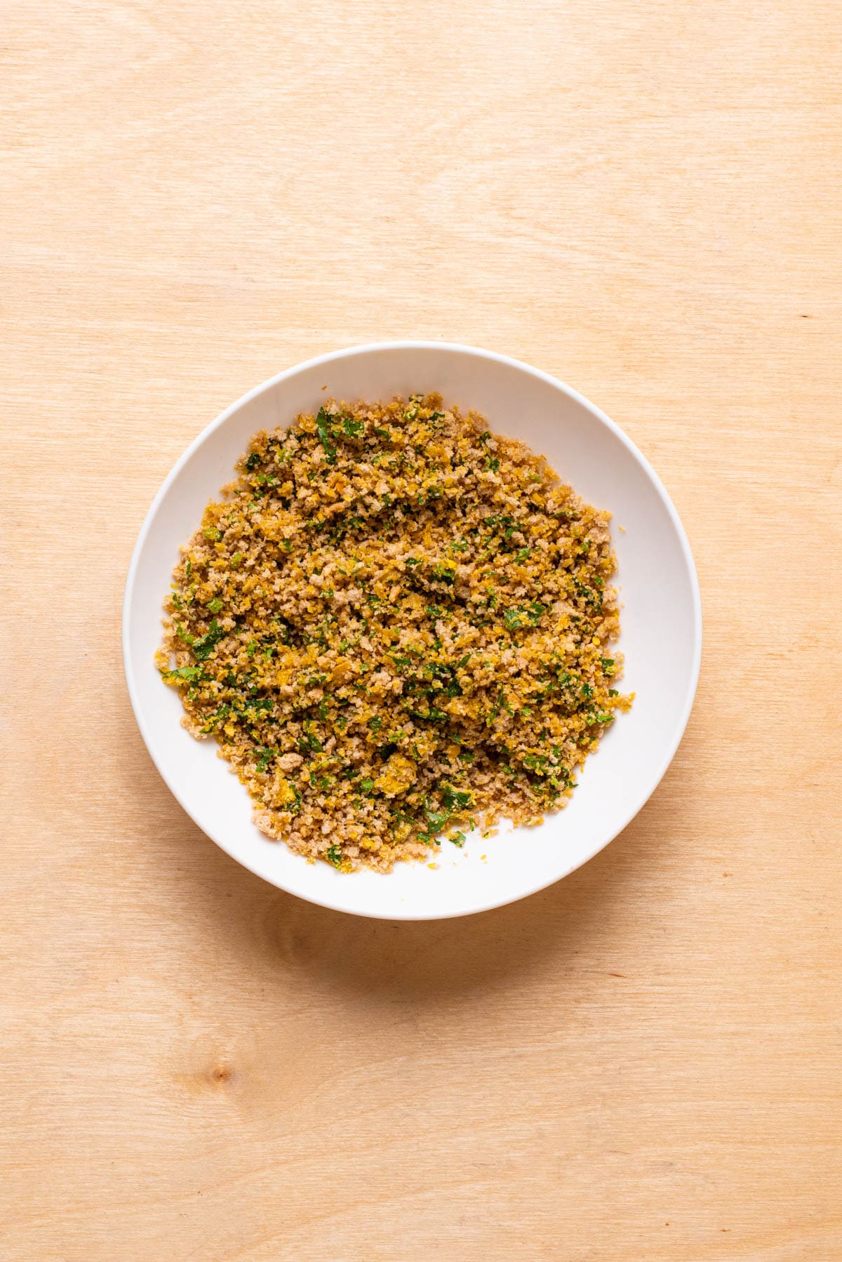 Panko-parsley mixture in a bowl.