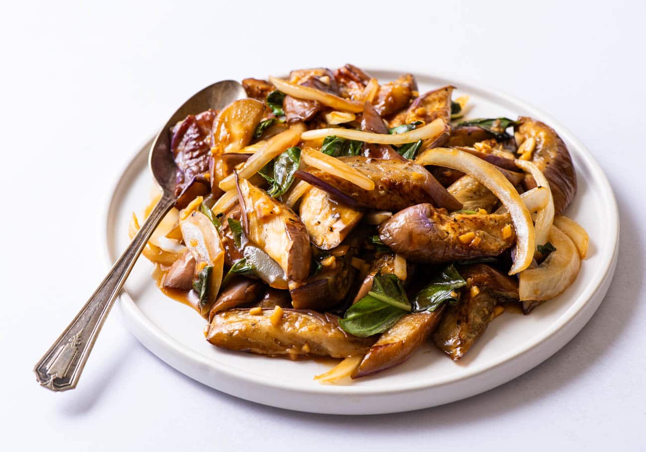 Chinese eggplant stir-fry on a white plate.