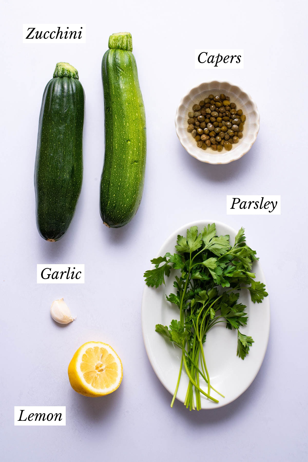 Ingredients gathered to make pan-fried zucchini with capers.