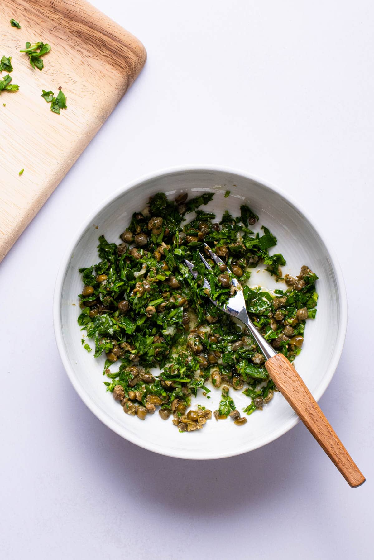 Parsley-caper relish in a bowl.