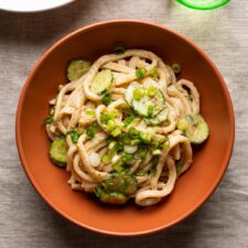 Cold tahini noodles with cucumbers and scallions.