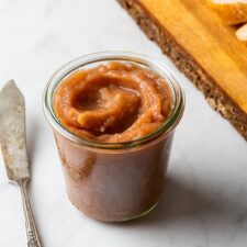 Homemade sugar-free apple butter in a jar.